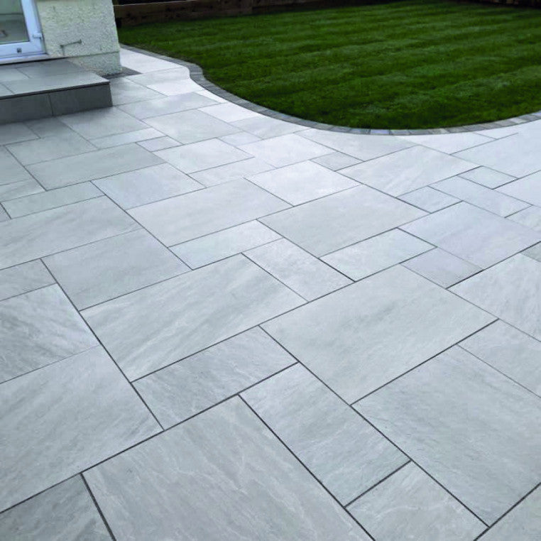 Lakestone Grey patio pack with soft grey hues and natural riven texture, perfect for creating stylish and durable outdoor patios.