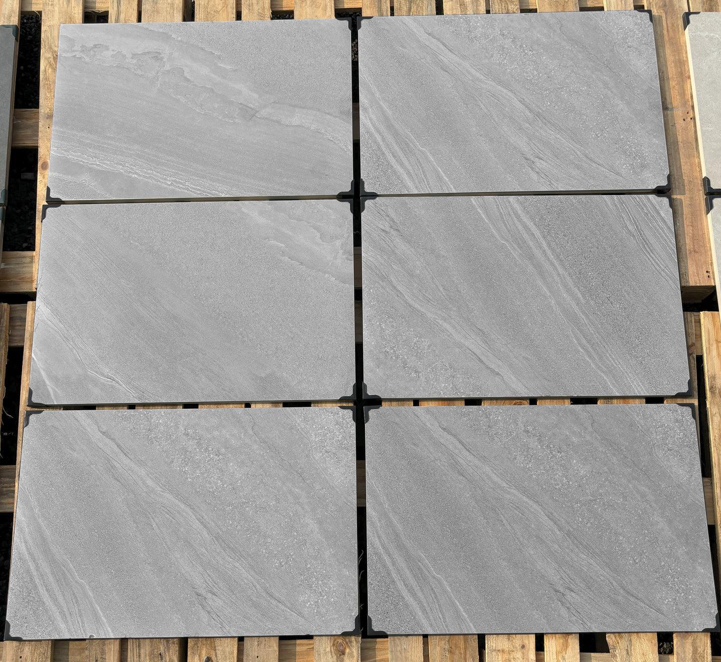 Crossover Grey Porcelain Paving Slabs β medium grey outdoor tiles with a smooth textured finish, perfect for contemporary patios and garden areas