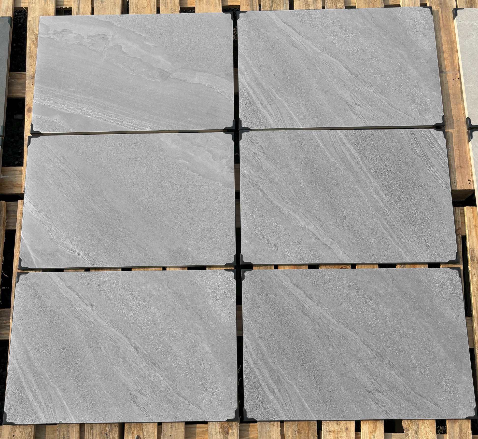 Crossover Grey Porcelain Paving Slabs β medium grey outdoor tiles with a smooth textured finish, perfect for contemporary patios and garden areas