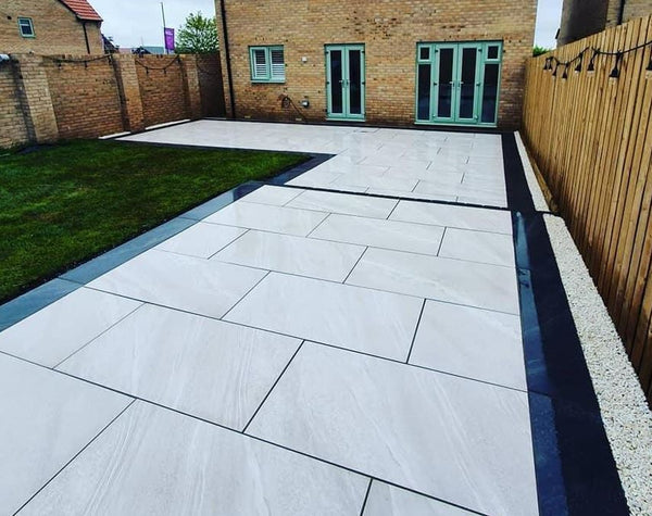 Crossover White Paving Slabs β crisp white outdoor tiles with a subtle textured finish, ideal for modern and low-maintenance patios