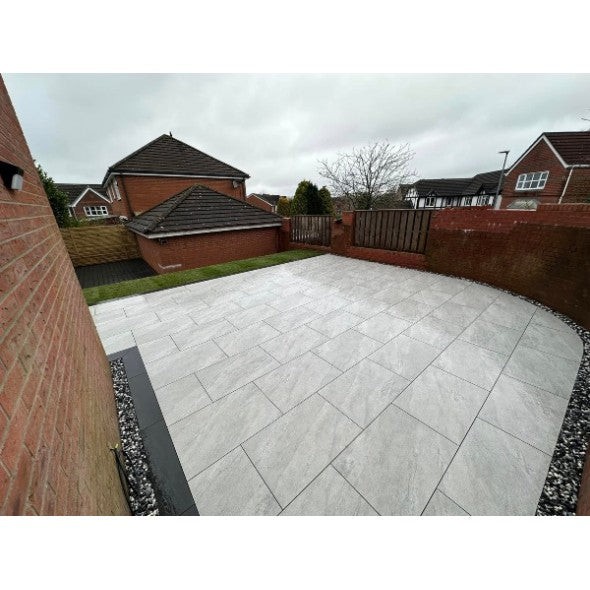 Dome Grey Patio Slabs β medium grey outdoor tiles with a subtle textured finish, ideal for contemporary patios and garden spaces