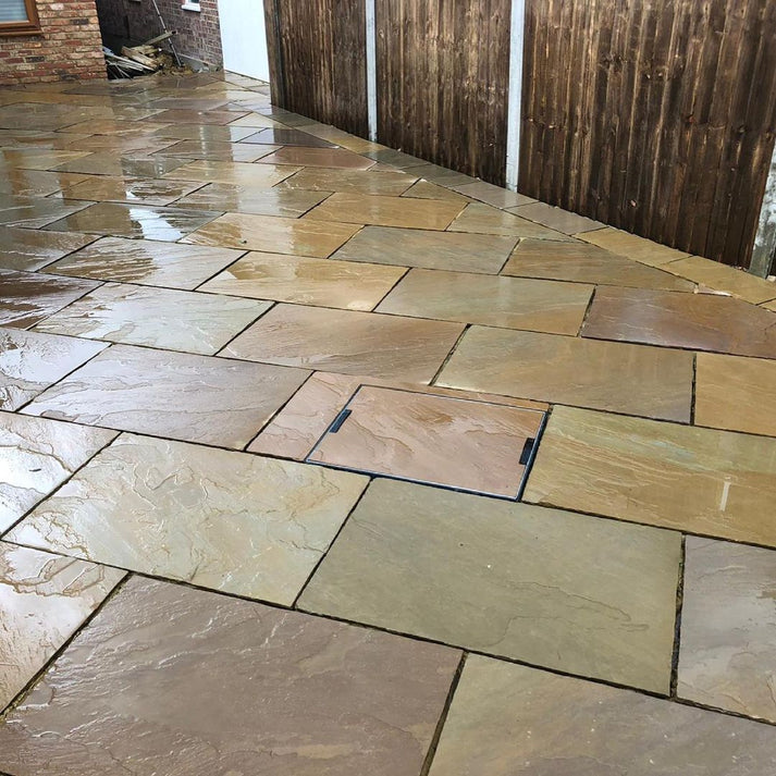 Rippon Buff Indian Sandstone Paving Slabs 900x600 mm β Natural riven surface with golden and brown tones for elegant patio paving