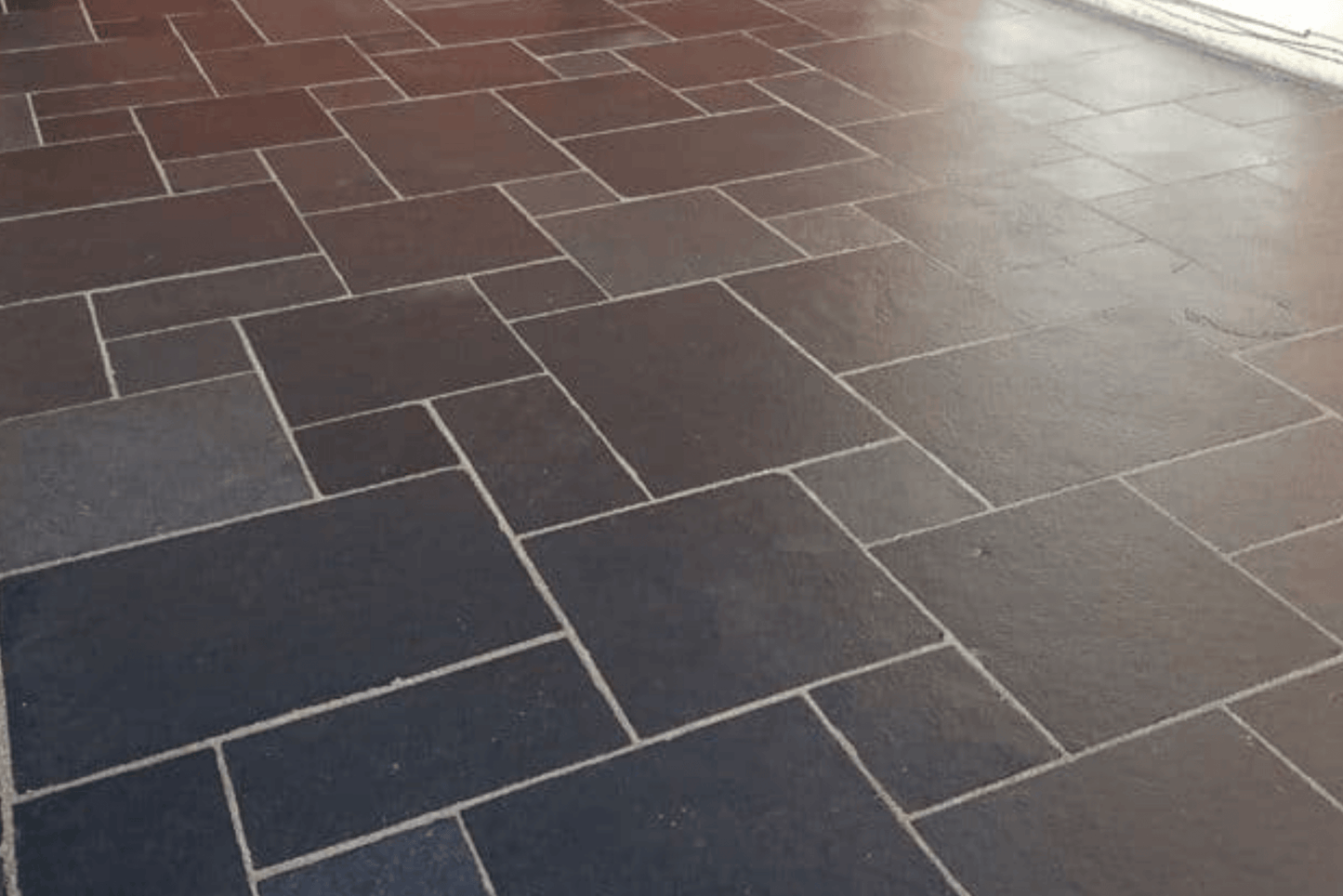 Black Limestone paving slabs with rich black tones and a lightly textured finish, ideal for creating bold and contemporary outdoor spaces.