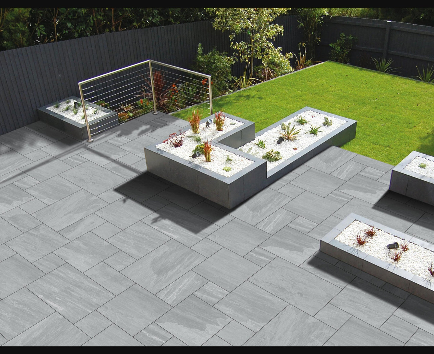 Lakestone Grey Garden Slabs with soft grey hues and natural riven texture, perfect for creating stylish and durable outdoor patios.