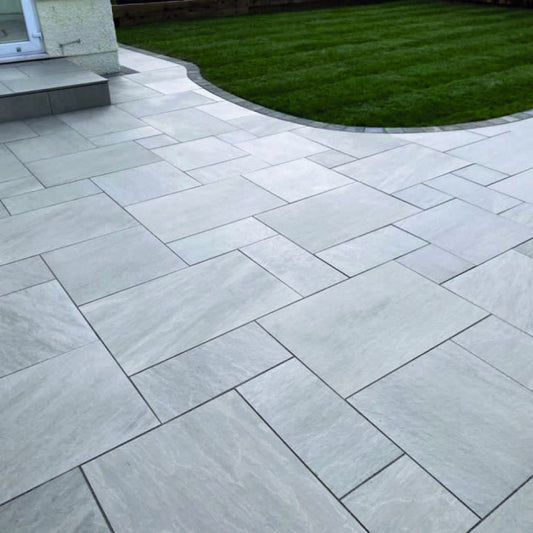 Lakestone Grey patio pack with soft grey hues and natural riven texture, perfect for creating stylish and durable outdoor patios.