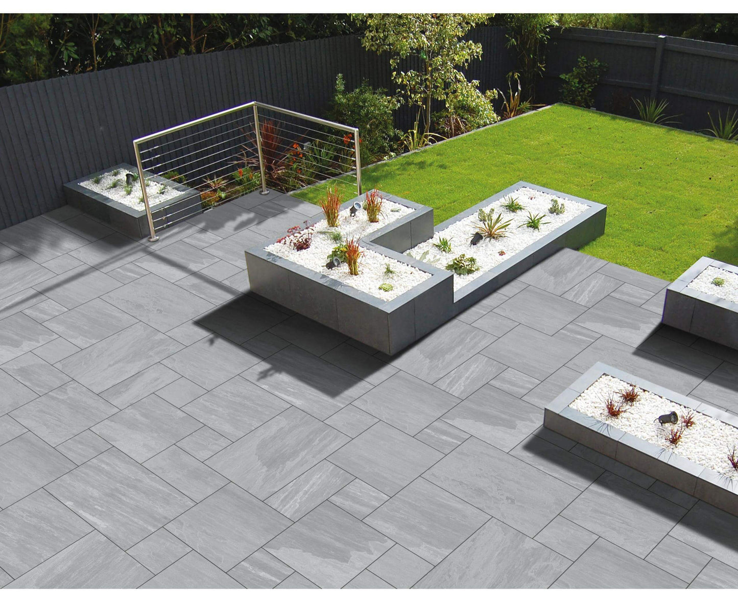 Lakestone Grey paving slabs with soft grey hues and a natural riven texture, perfect for stylish patios and garden pathways.