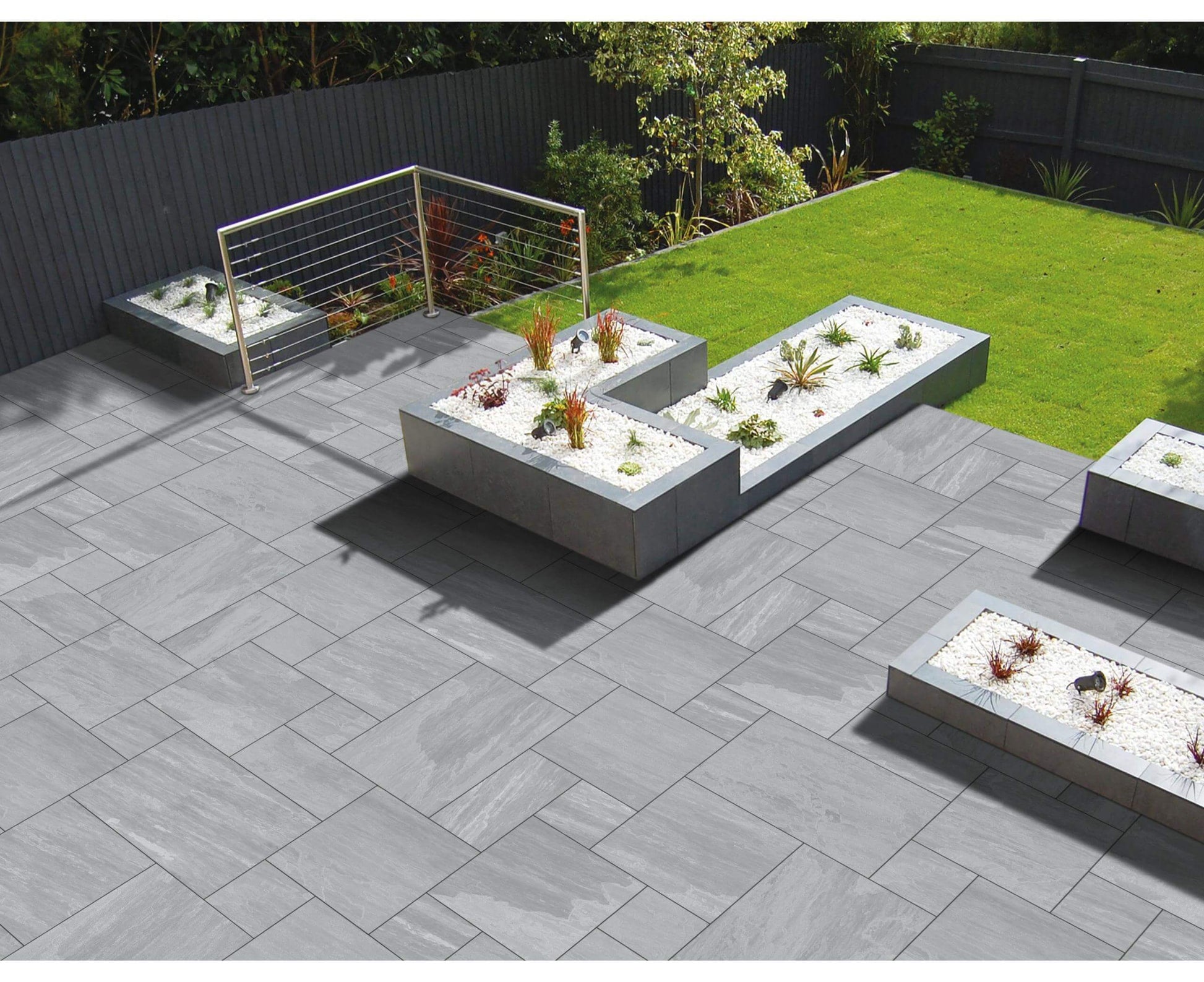 Lakestone Grey paving slabs with soft grey hues and a natural riven texture, perfect for stylish patios and garden pathways.