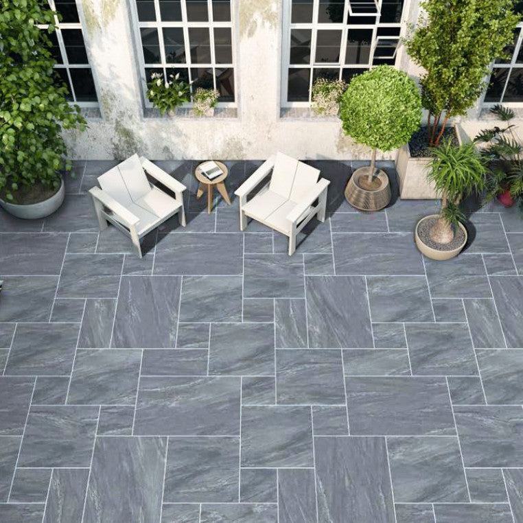 Midnight Stone patio slabs with deep charcoal and black tones, offering a sleek, contemporary look for patios, pathways, and driveways.