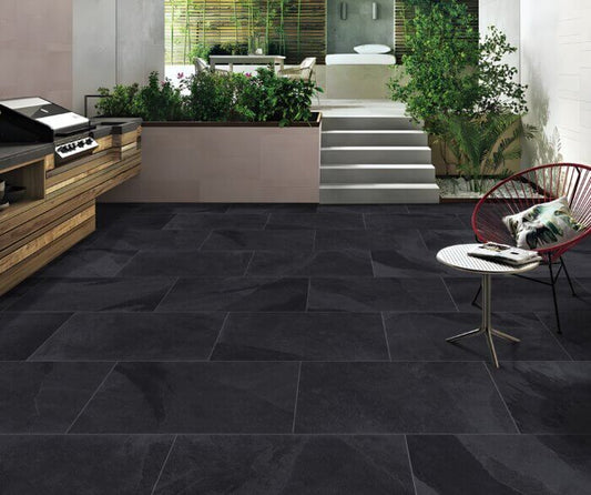 Obsidian Black paving slabs with deep black color and sleek smooth finish, ideal for contemporary patios and walkways.