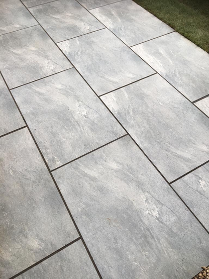 EC Grey Paving Slabs – Elegant light grey porcelain paving with a subtle stone effect finish for contemporary outdoor spaces