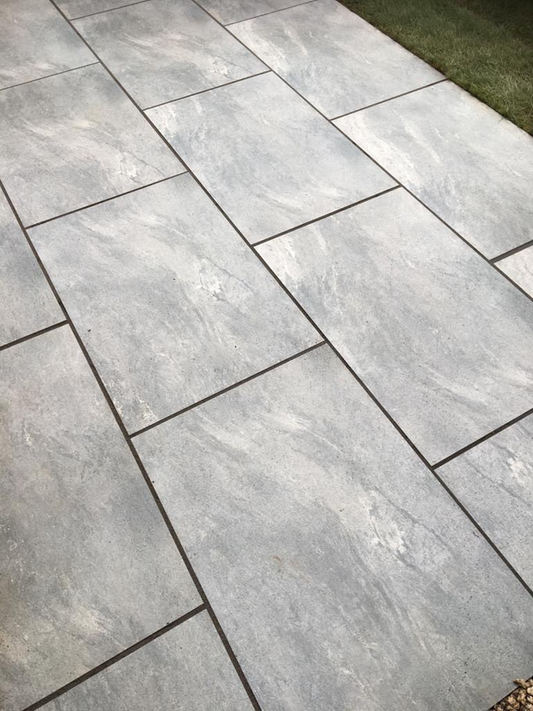 EC Grey Paving Slabs – Elegant light grey porcelain paving with a subtle stone effect finish for contemporary outdoor spaces