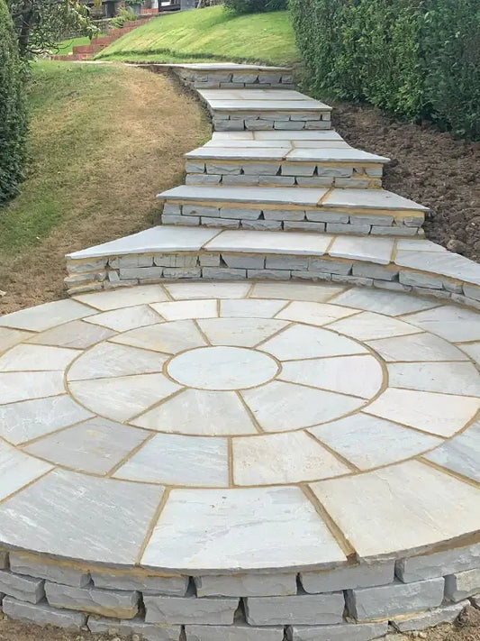 Kandla Grey circle paving stone with a smooth sandstone finish and cool grey tones, perfect for modern outdoor spaces.